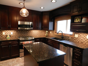 Modern Dark Wood Cabinets and Granite counter tops.