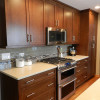 Brown Kitchen Cabinets with white countertop